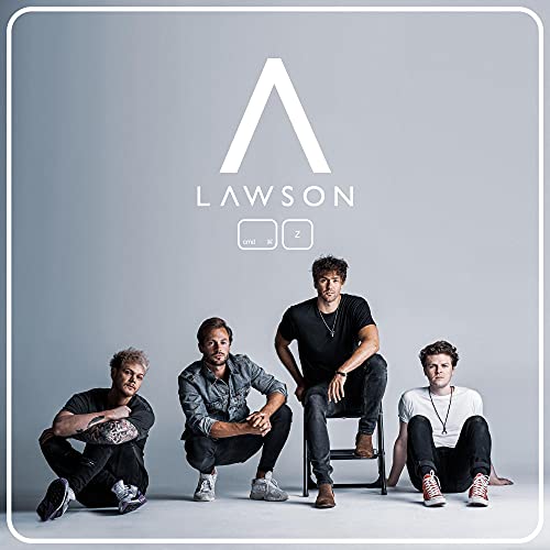 "Album cover with four men posing in front of a gray background."