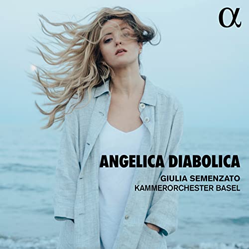 CD cover: woman with flowing hair against a blurred ocean backdrop.