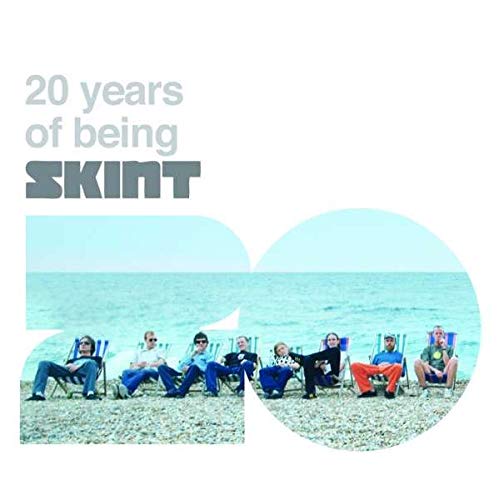 "Album cover with '20' formed by men sitting on a beach."