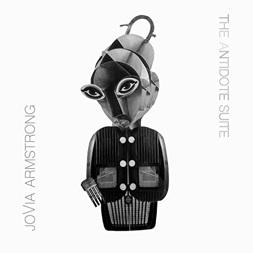 CD cover featuring a geometric, stylized portrait in grayscale.