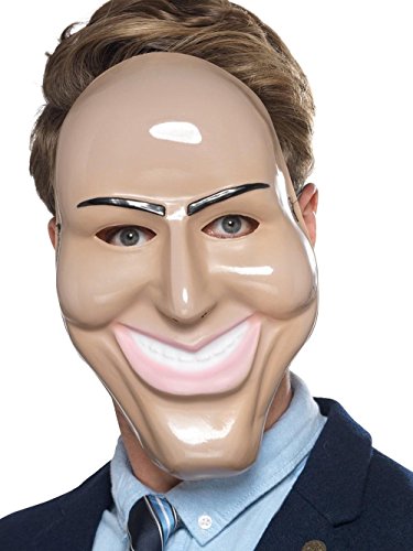 Man wearing a latex mask with a wide, toothy grin and dark eyebrows.