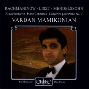 A CD cover featuring a man in a tuxedo against a dark, cloudy background.
