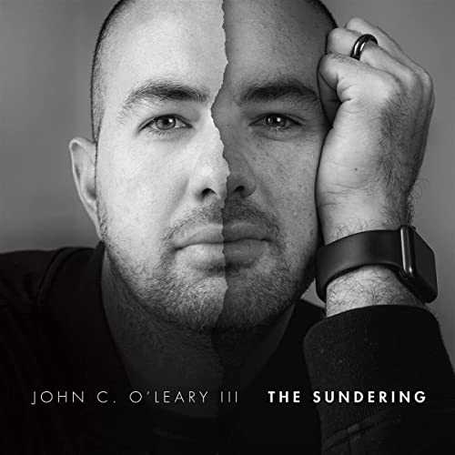 Black and white portrait of a man with a split face, album cover.