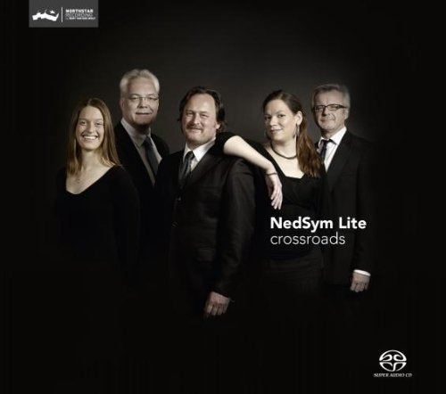 CD cover featuring four musicians in formal attire against a dark background.