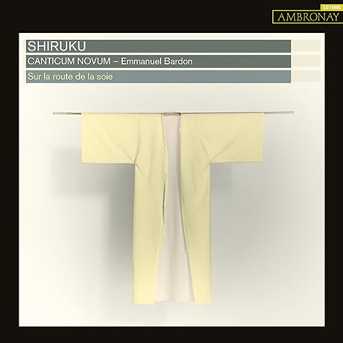 CD cover with a pale yellow kimono hanging on a clothesline.