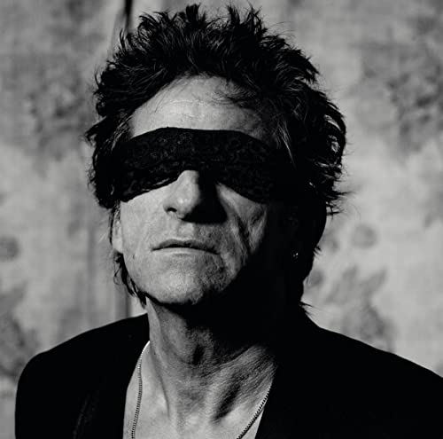 Black and white portrait of a man with a black blindfold.
