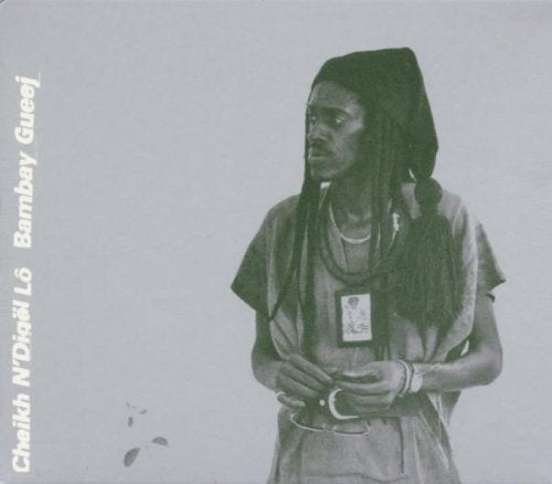 Black and white CD cover featuring a man with braids and jewelry.