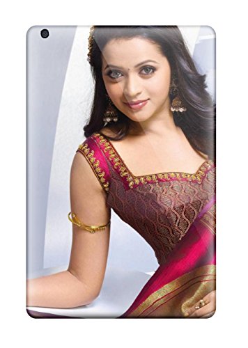 Woman in traditional Indian clothing, smiling, on a rectangular surface.