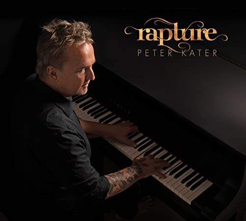 Peter Kater at a grand piano, album cover for “Rapture” CD.
