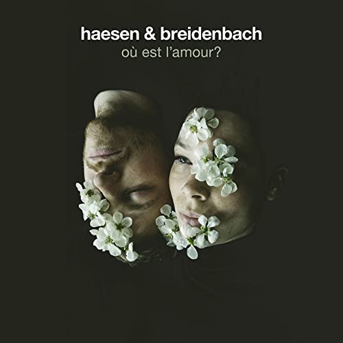 CD cover: two faces with flowers, dark background, text "haesen & breidenbach".