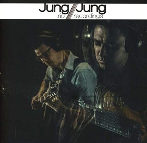 CD cover featuring two musicians with instruments in a studio setting.