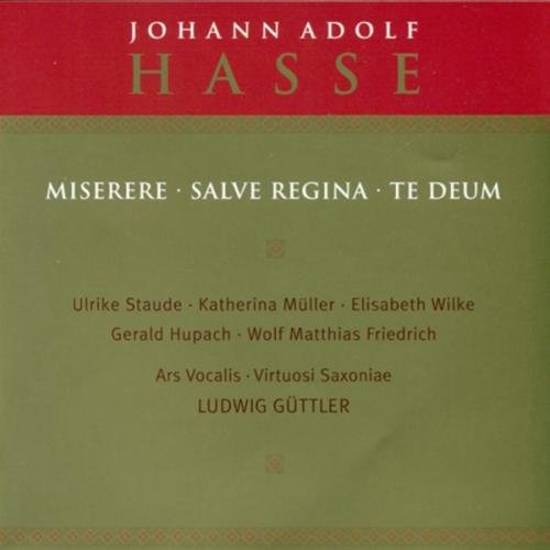 A CD cover with red and beige design, featuring angel illustrations.
