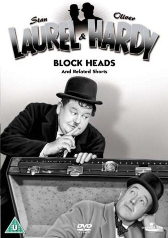 "Black and white DVD cover featuring Laurel and Hardy in bowler hats, one emerging from a trunk."