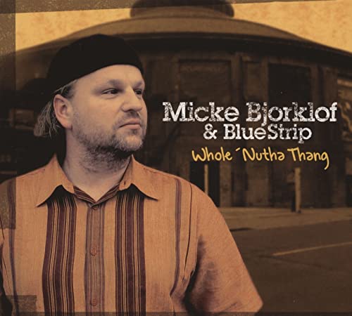 CD cover featuring Micke Bjorklof and Bluetrip, with a building backdrop.