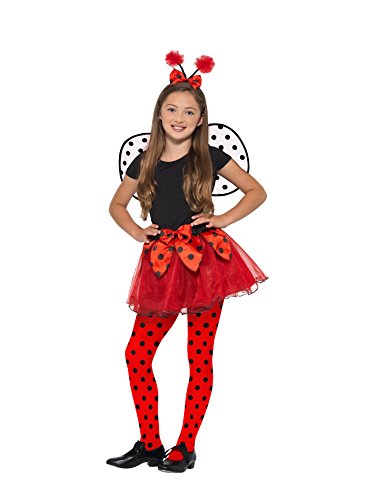 A young girl wearing a ladybird costume, featuring red and black attire and wings.