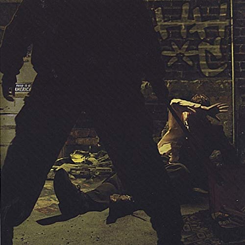 CD cover with silhouetted figures against a graffiti-covered brick wall.