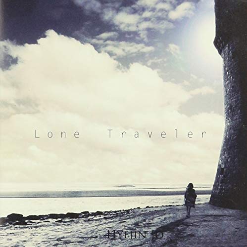 CD cover: lone figure by the sea under cloudy sky.