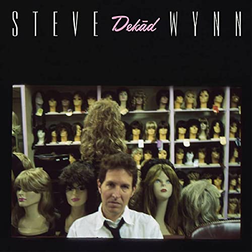 Steve Wynn album cover: man seated among many mannequin heads.