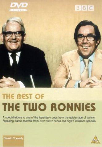 DVD cover featuring two men in suits and glasses smiling.
