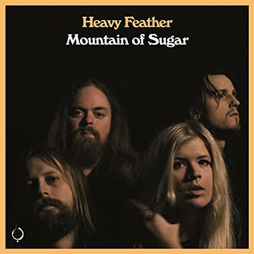 Album cover for Heavy Featherās āMountain of Sugarā featuring four people.