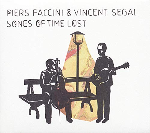 Vinyl album cover featuring silhouettes of two musicians playing instruments under a street lamp.