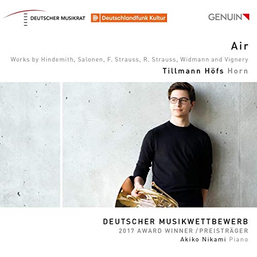 "CD cover with a man holding a French horn, wearing a black shirt."