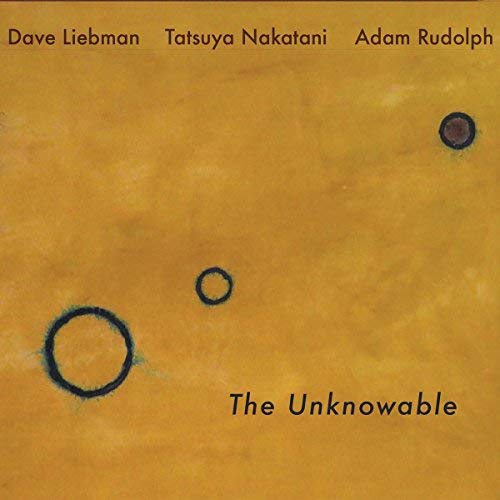 Yellow album cover with three dark circles and text “The Unknowable”.