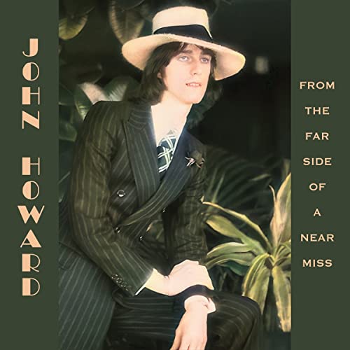 CD cover: John Howard in suit and hat, green foliage background.