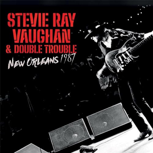 Stevie Ray Vaughan & Double Trouble album cover, live performance photo.