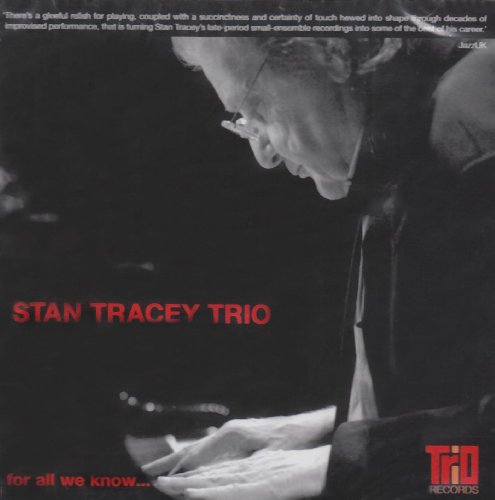 Black and white image of a man playing piano, with red text overlay on album cover.