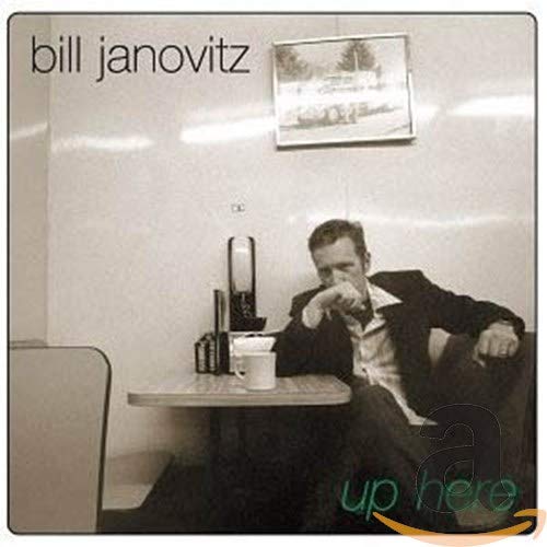 Black and white album cover featuring a man seated in a diner booth.