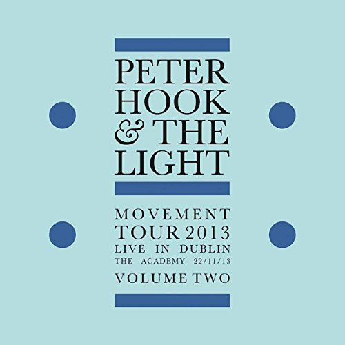"Light blue album cover with black text and blue rectangles and dots."