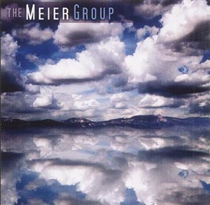 CD cover for "Ribbon In The Wind" with cloudy sky and mountains.