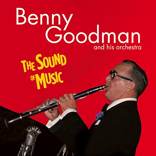Benny Goodman playing clarinet on album cover with red background.
