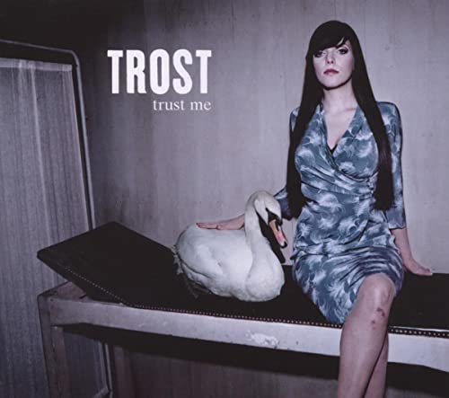 CD cover: woman with swan, piano, and textured grey background.