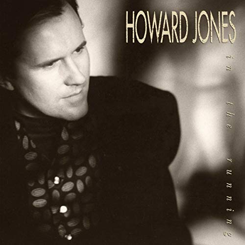 Howard Jones album cover, "In The Running," featuring a portrait of the artist.