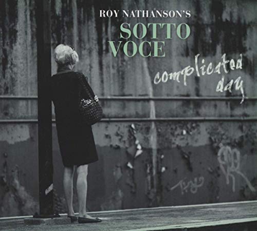 CD cover: woman seen from behind, urban background, text “Complicated Day”.