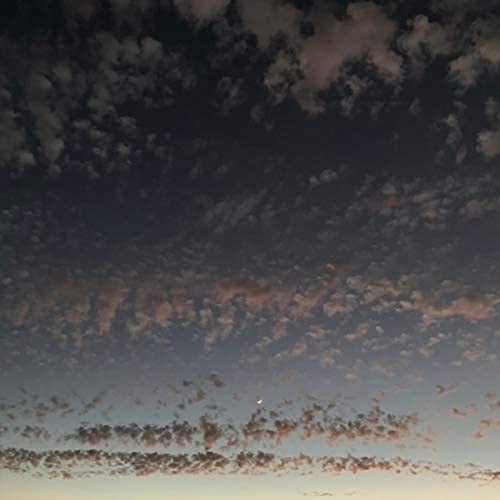 CD cover with a dark, cloudy sky and a pale horizon.