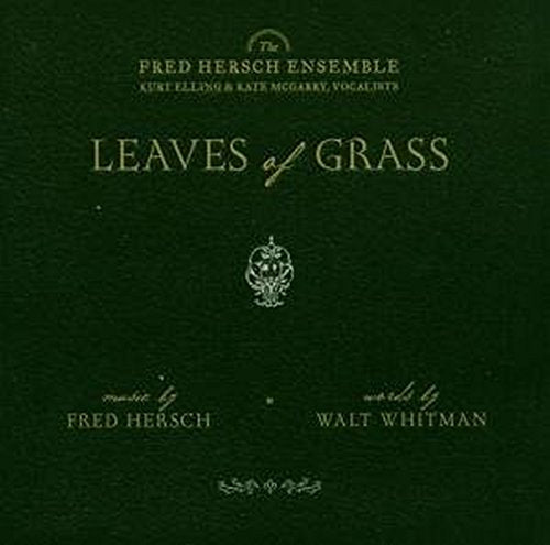 Dark green album cover with gold text and a small floral emblem.