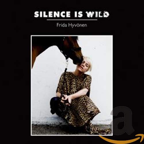 CD cover: woman with a horse, text “Silence Is Wild” and artist name.