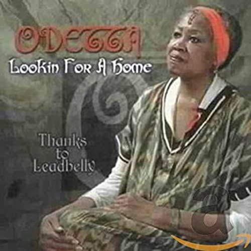 CD cover featuring Odetta in a patterned shirt and orange headwrap.