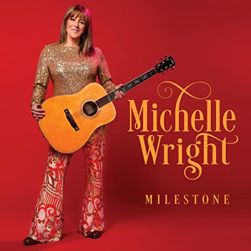 Michelle Wright holds an acoustic guitar, album cover for "Milestone".