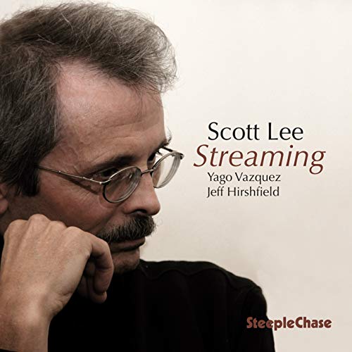 Album cover featuring a man with glasses and a contemplative expression, with text overlay.