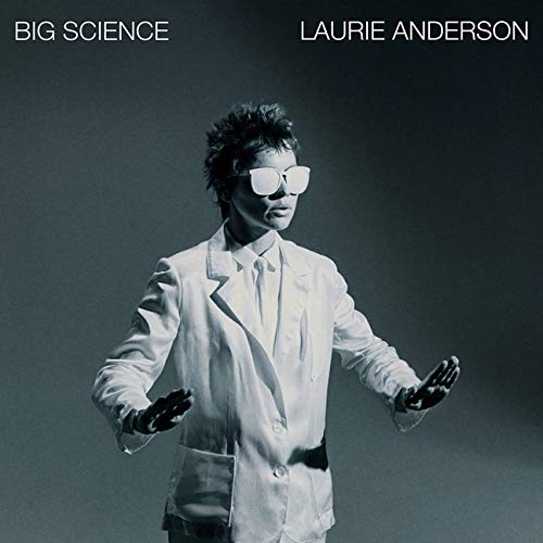 Laurie Anderson in white suit and sunglasses, album cover "Big Science".