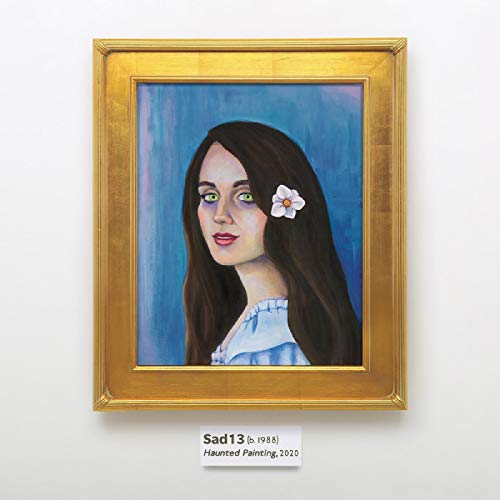 Framed painting of a woman with long dark hair and a white flower.