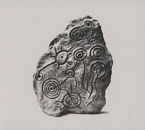 CD cover: stone carving with spiral and circular designs.