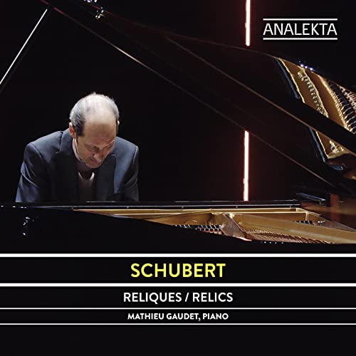 CD cover: pianist Mathieu Gaudet at a grand piano, album “Relics”.