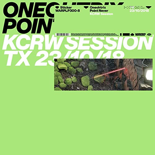 Lime green vinyl record cover with text and a rocky landscape image.