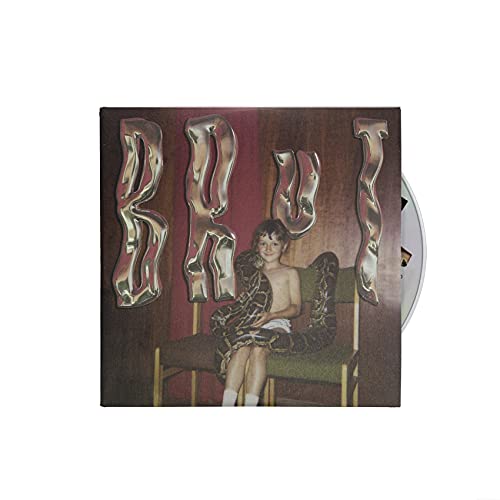 A CD case featuring a woman sitting on a chair, partially unclothed, with "BROD" written on it.