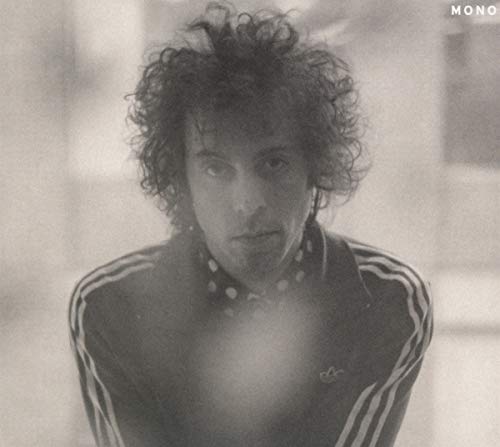BlackLofi black and white photo of a man with curly hair in a tracksuit.